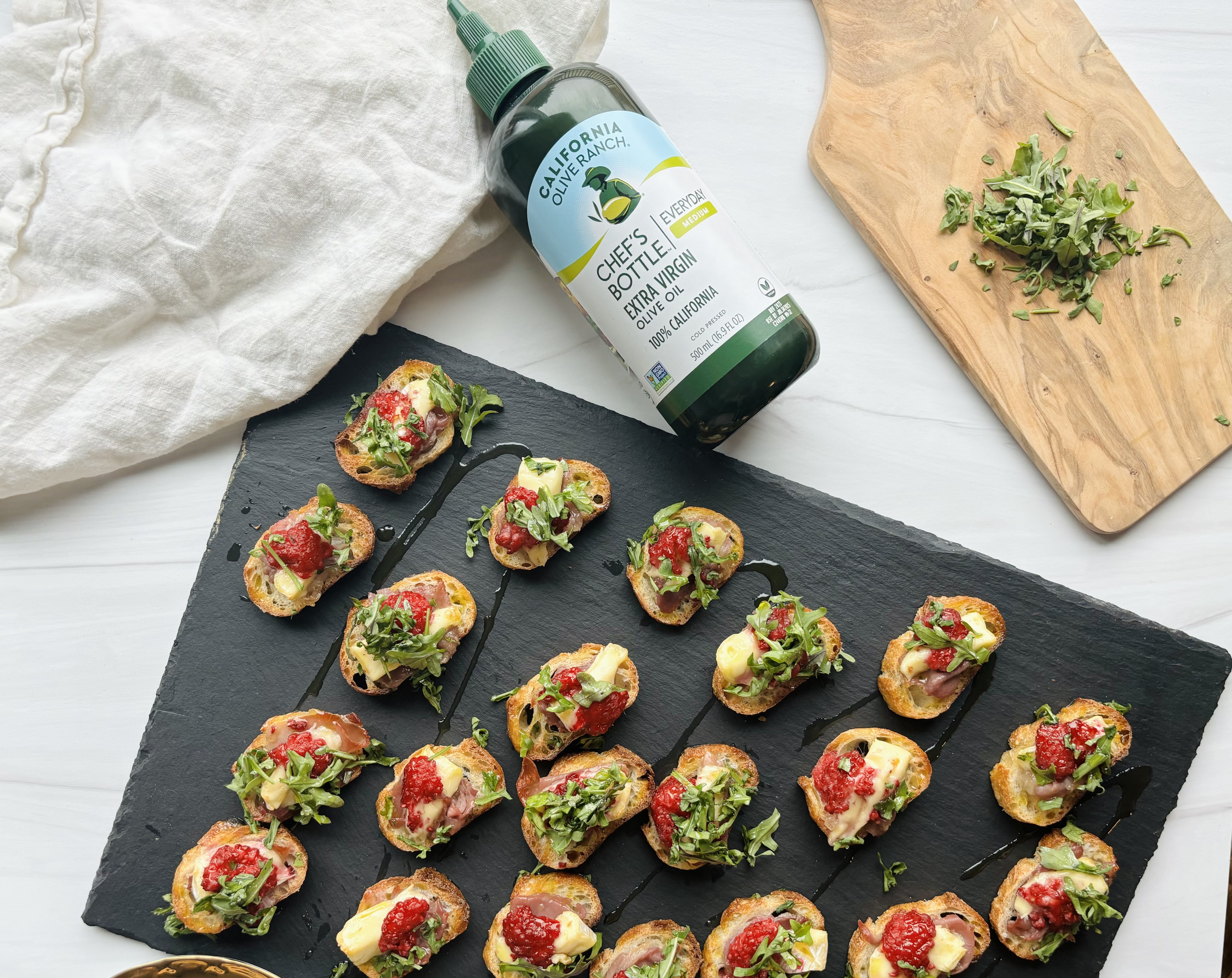 Smashed Raspberry, Prosciutto and Brie Crostini | California Olive Ranch